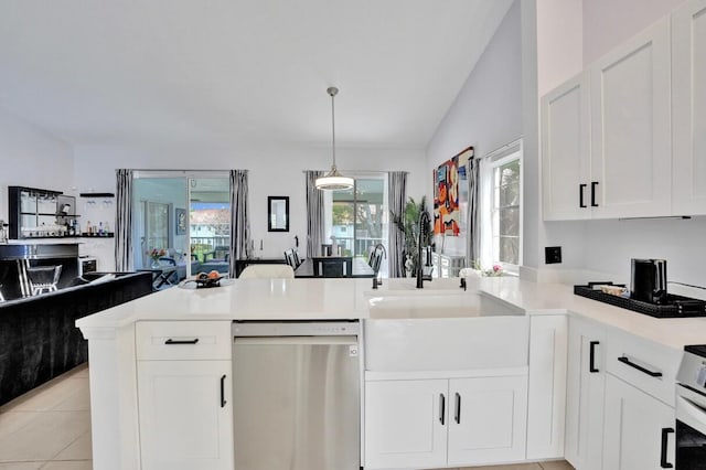 7669 Springwater Pl Unit 202, Boynton Beach, FL 33437 - kitchen featuring a peninsula, open floor plan, light countertops, white cabinets, and dishwasher