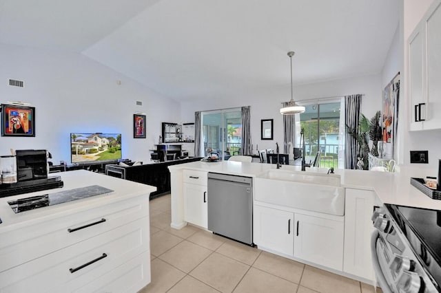 7669 Springwater Pl Unit 202, Boynton Beach, FL 33437 - kitchen with stainless steel appliances, a peninsula, light tile patterned floors, vaulted ceiling, and visible vents