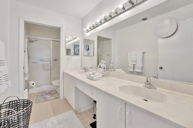7669 Springwater Pl Unit 202, Boynton Beach, FL 33437 - bathroom featuring tile patterned flooring, a sink, a stall shower, and toilet
