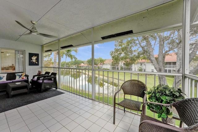7669 Springwater Pl Unit 202, Boynton Beach, FL 33437 - sunroom featuring a water view, outdoor lounge area, and a ceiling fan