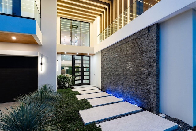 217 Thatch Palm Dr, Boca Raton, FL 33432 - view of exterior entry featuring stucco siding