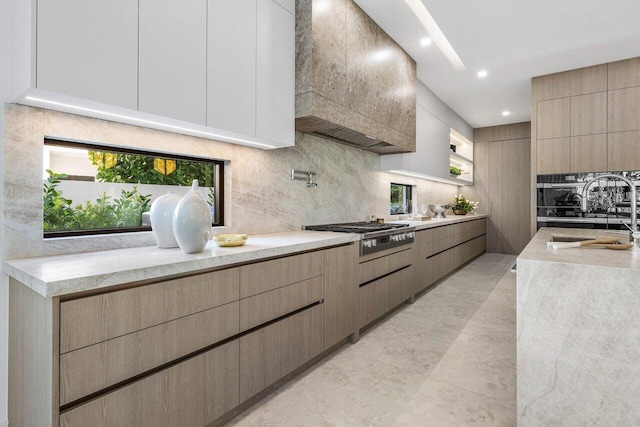 217 Thatch Palm Dr, Boca Raton, FL 33432 - kitchen featuring appliances with stainless steel finishes, a sink, modern cabinets, decorative backsplash, and custom exhaust hood