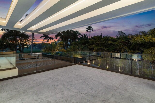 217 Thatch Palm Dr, Boca Raton, FL 33432 - view of patio terrace at dusk