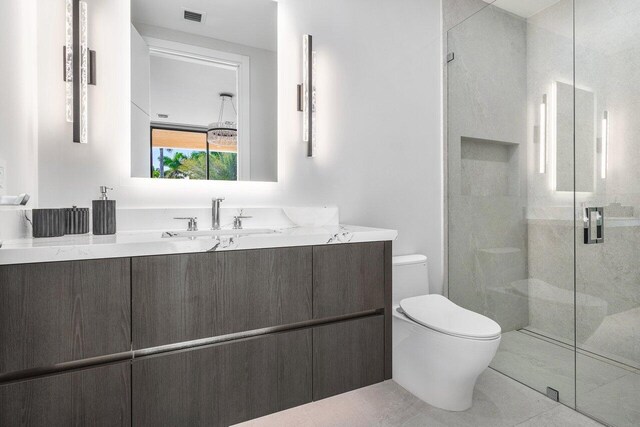217 Thatch Palm Dr, Boca Raton, FL 33432 - bathroom with toilet, a shower stall, and vanity