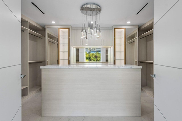 217 Thatch Palm Dr, Boca Raton, FL 33432 - walk in closet with a chandelier