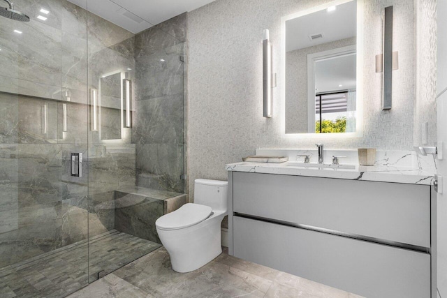 217 Thatch Palm Dr, Boca Raton, FL 33432 - bathroom featuring toilet, marble finish floors, a marble finish shower, and vanity