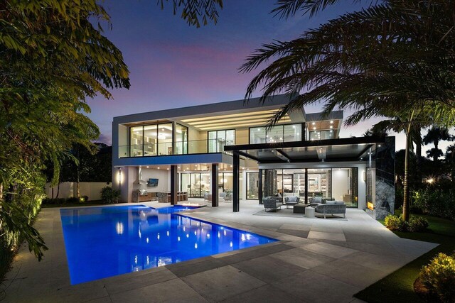217 Thatch Palm Dr, Boca Raton, FL 33432 - back of house featuring an outdoor hangout area, a balcony, and a patio area