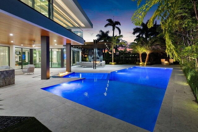 217 Thatch Palm Dr, Boca Raton, FL 33432 - outdoor pool featuring outdoor lounge area, a ceiling fan, a pergola, and a patio