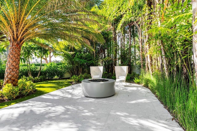 217 Thatch Palm Dr, Boca Raton, FL 33432 - view of patio with a fire pit