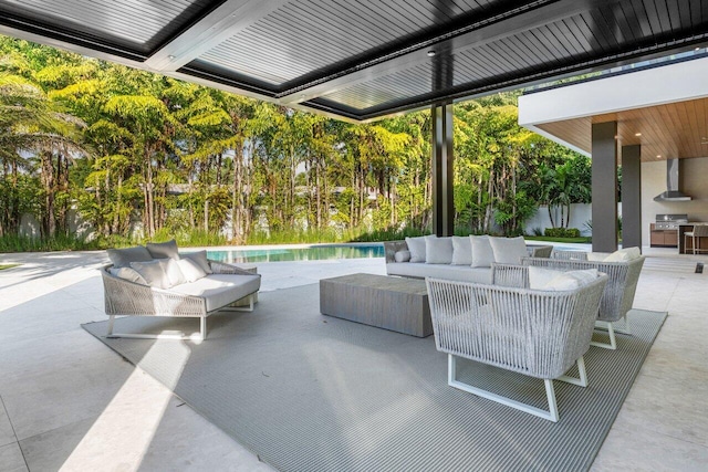 217 Thatch Palm Dr, Boca Raton, FL 33432 - view of patio with an outdoor living space, an outdoor pool, exterior kitchen, and view of scattered trees