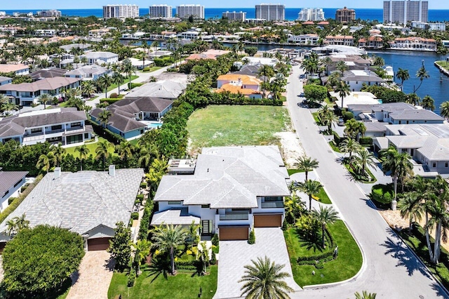 view of urban area featuring a large body of water and nearby suburban area