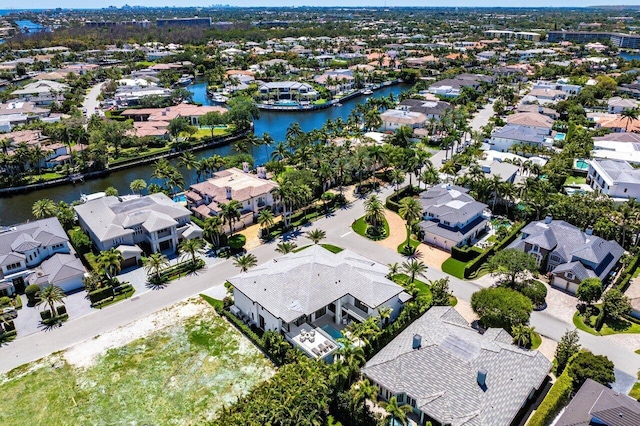aerial view of residential area featuring a nearby body of water