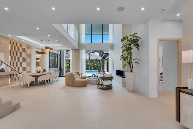 2498 Queen Palm Rd, Boca Raton, FL 33432 - living room featuring recessed lighting, a high ceiling, and stairway