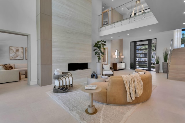 2498 Queen Palm Rd, Boca Raton, FL 33432 - living room with a high ceiling, recessed lighting, and a premium fireplace