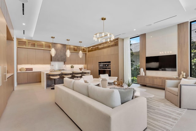 2498 Queen Palm Rd, Boca Raton, FL 33432 - living room with expansive windows, recessed lighting, and a chandelier