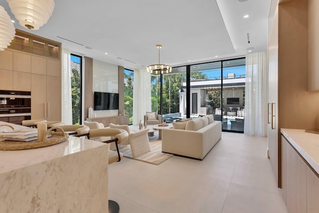 2498 Queen Palm Rd, Boca Raton, FL 33432 - living room featuring expansive windows, a chandelier, and recessed lighting
