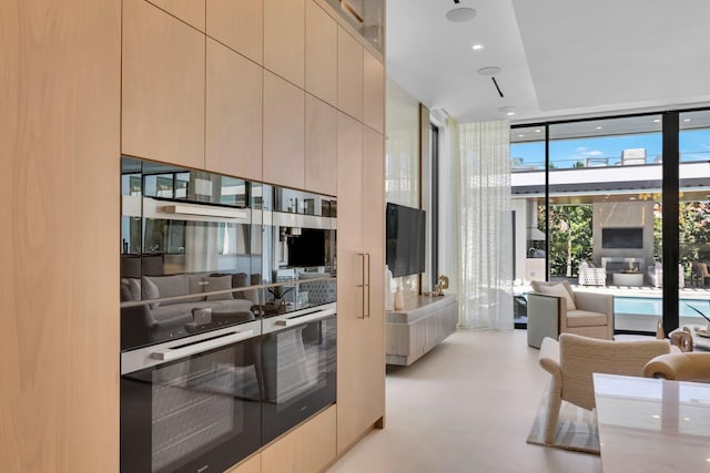 2498 Queen Palm Rd, Boca Raton, FL 33432 - kitchen featuring floor to ceiling windows, modern cabinets, and wall oven