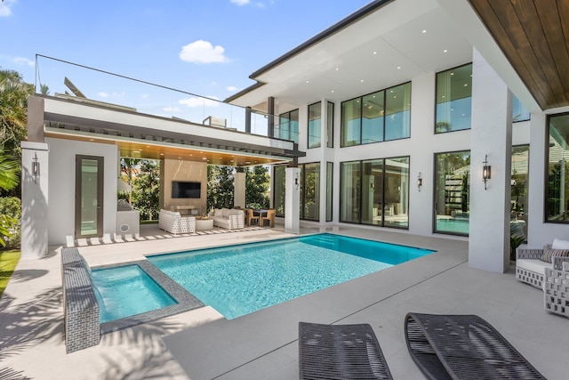 2498 Queen Palm Rd, Boca Raton, FL 33432 - rear view of house with outdoor lounge area, a patio, stucco siding, and a pool with connected hot tub