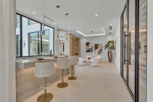 2498 Queen Palm Rd, Boca Raton, FL 33432 - bar with a raised ceiling, pendant lighting, recessed lighting, and finished concrete floors