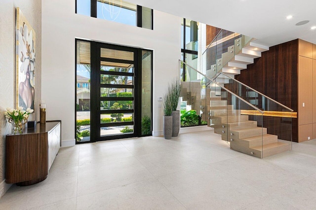2498 Queen Palm Rd, Boca Raton, FL 33432 - foyer featuring stairway, recessed lighting, and a towering ceiling