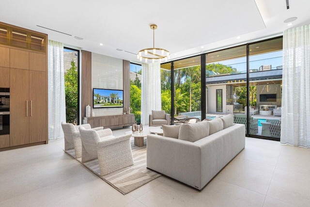 living room with expansive windows, a chandelier, recessed lighting, and light tile patterned floors