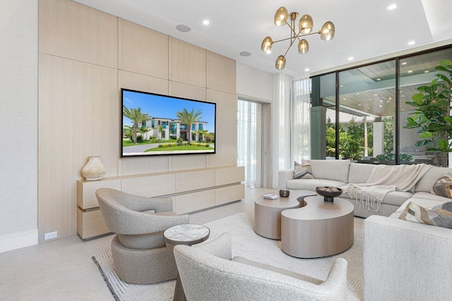 living room featuring floor to ceiling windows, a chandelier, recessed lighting, and baseboards