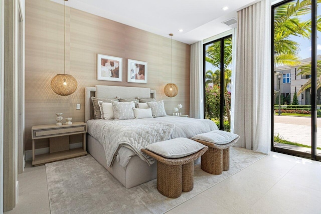 bedroom with access to outside and wallpapered walls