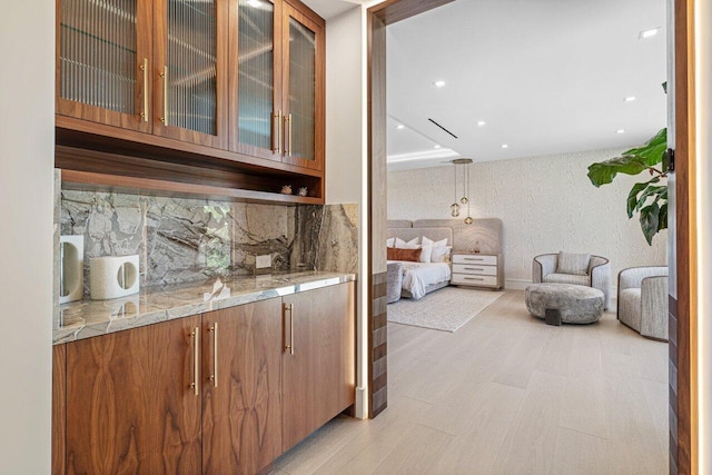 2498 Queen Palm Rd, Boca Raton, FL 33432 - bar area with decorative backsplash, recessed lighting, and light wood finished floors