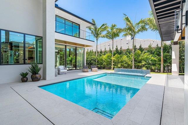 swimming pool featuring a patio area