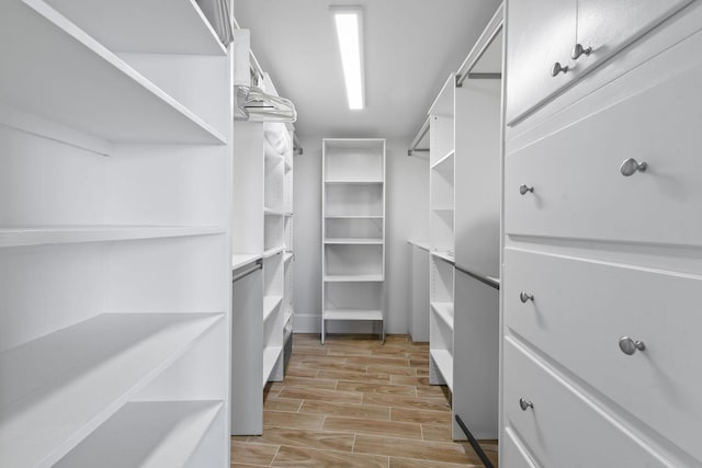 spacious closet with light wood finished floors