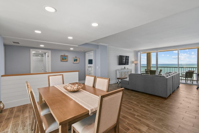 dining room featuring wood finished floors and recessed lighting