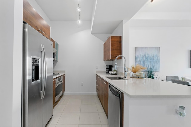 480 Hibiscus St Unit 1003, West Palm Beach, FL 33401 - kitchen featuring light countertops, appliances with stainless steel finishes, a sink, and modern cabinets