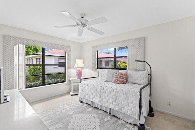 9750 Tabebuia Tree Dr Unit A, Boynton Beach, FL 33436 - bedroom featuring baseboards, multiple windows, and light colored carpet