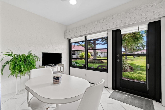 9750 Tabebuia Tree Dr Unit A, Boynton Beach, FL 33436 - dining area featuring light tile patterned floors and a textured wall