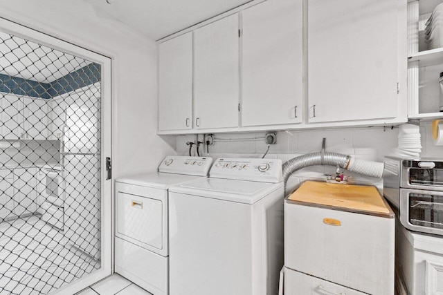 9750 Tabebuia Tree Dr Unit A, Boynton Beach, FL 33436 - laundry area featuring cabinet space and separate washer and dryer