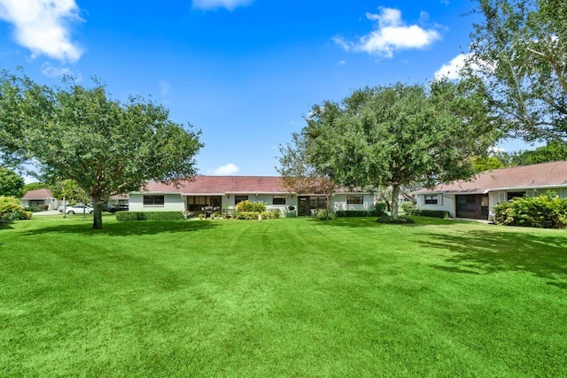 9750 Tabebuia Tree Dr Unit A, Boynton Beach, FL 33436 - rear view of house featuring a yard