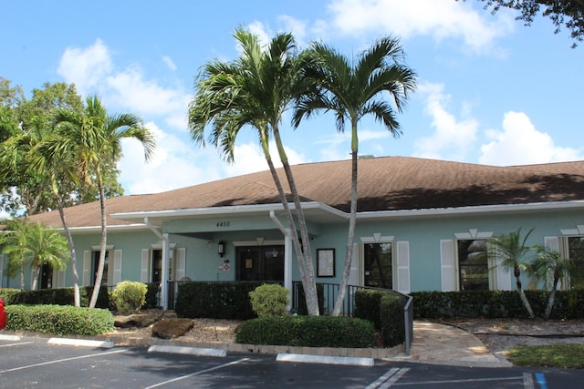 9750 Tabebuia Tree Dr Unit A, Boynton Beach, FL 33436 - view of building exterior featuring uncovered parking