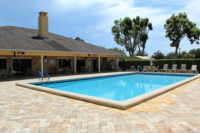 9750 Tabebuia Tree Dr Unit A, Boynton Beach, FL 33436 - community pool featuring outdoor dining area, a patio area, and fence