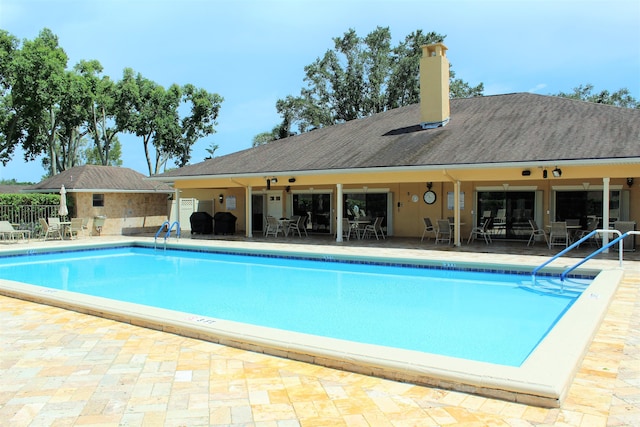 9750 Tabebuia Tree Dr Unit A, Boynton Beach, FL 33436 - community pool featuring a patio and fence