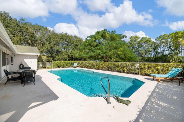 view of pool featuring a fenced in pool, a patio area, and fence