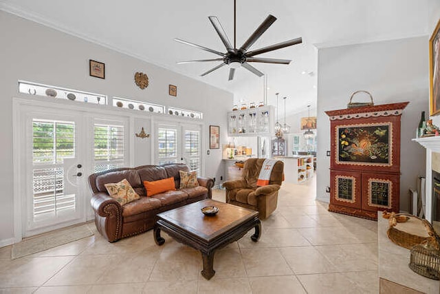 living room with a ceiling fan, french doors, plenty of natural light, and light tile patterned flooring