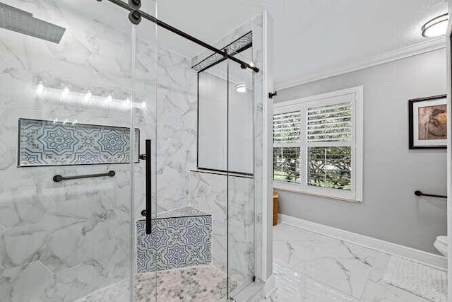 bathroom with baseboards, ornamental molding, a marble finish shower, and marble finish floor