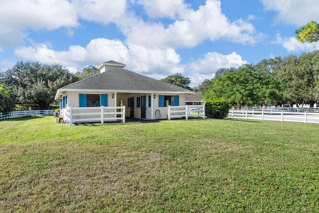 back of property featuring an outbuilding and an exterior structure