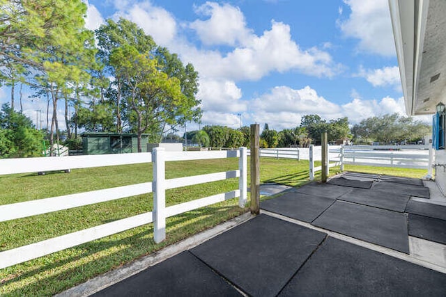 exterior space with a lawn and fence