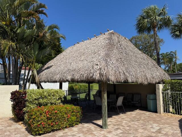 5674 Ainsley Ct, Boynton Beach, FL 33437 - view of property's community with a gazebo, outdoor dining space, and a patio area