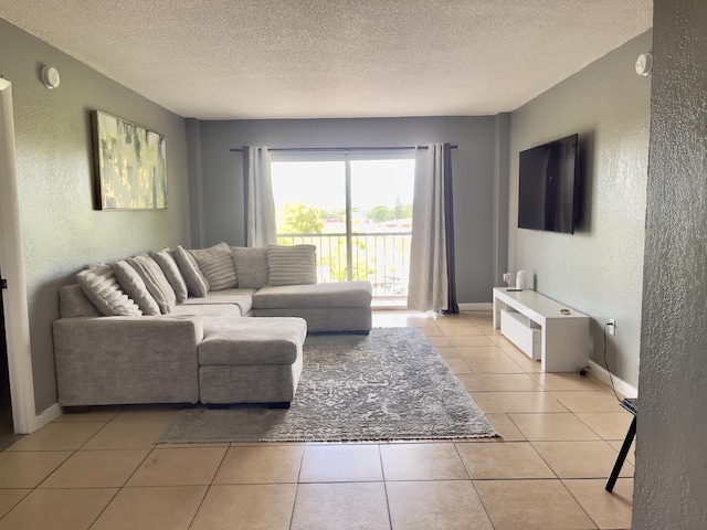 4172 Inverrary Dr Unit 507, Lauderhill, FL 33319 - living room with baseboards, a textured ceiling, a textured wall, and light tile patterned floors