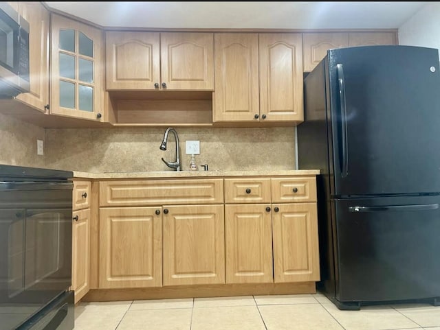 4172 Inverrary Dr Unit 507, Lauderhill, FL 33319 - kitchen with a sink, light countertops, range, freestanding refrigerator, and stainless steel microwave