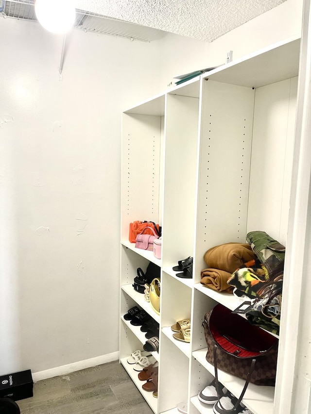 4172 Inverrary Dr Unit 507, Lauderhill, FL 33319 - walk in closet with visible vents and wood finished floors