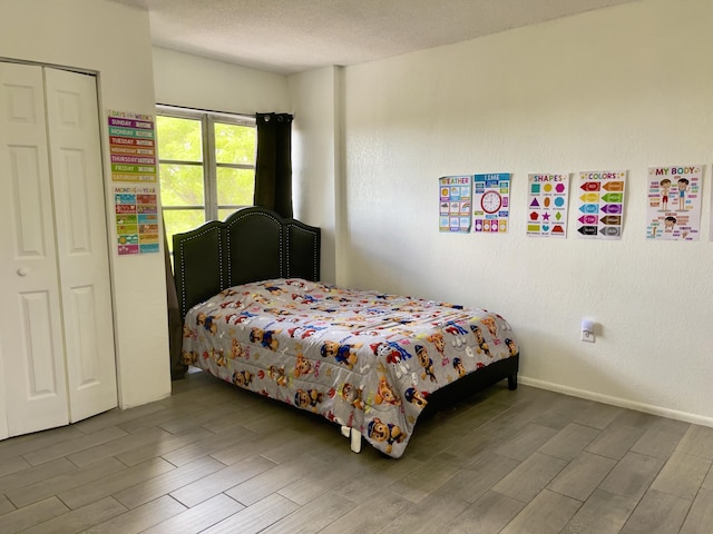 4172 Inverrary Dr Unit 507, Lauderhill, FL 33319 - bedroom with baseboards, wood finished floors, and a closet