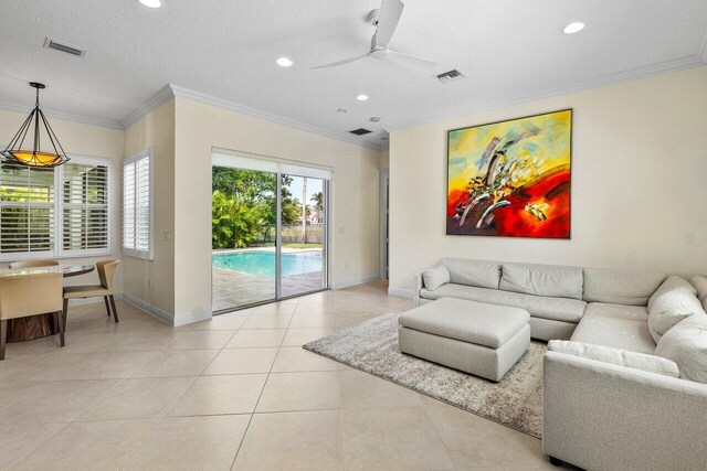 11952 Fox Hill Cir, Boynton Beach, FL 33473 - living room featuring crown molding, ceiling fan, recessed lighting, baseboards, and light tile patterned floors